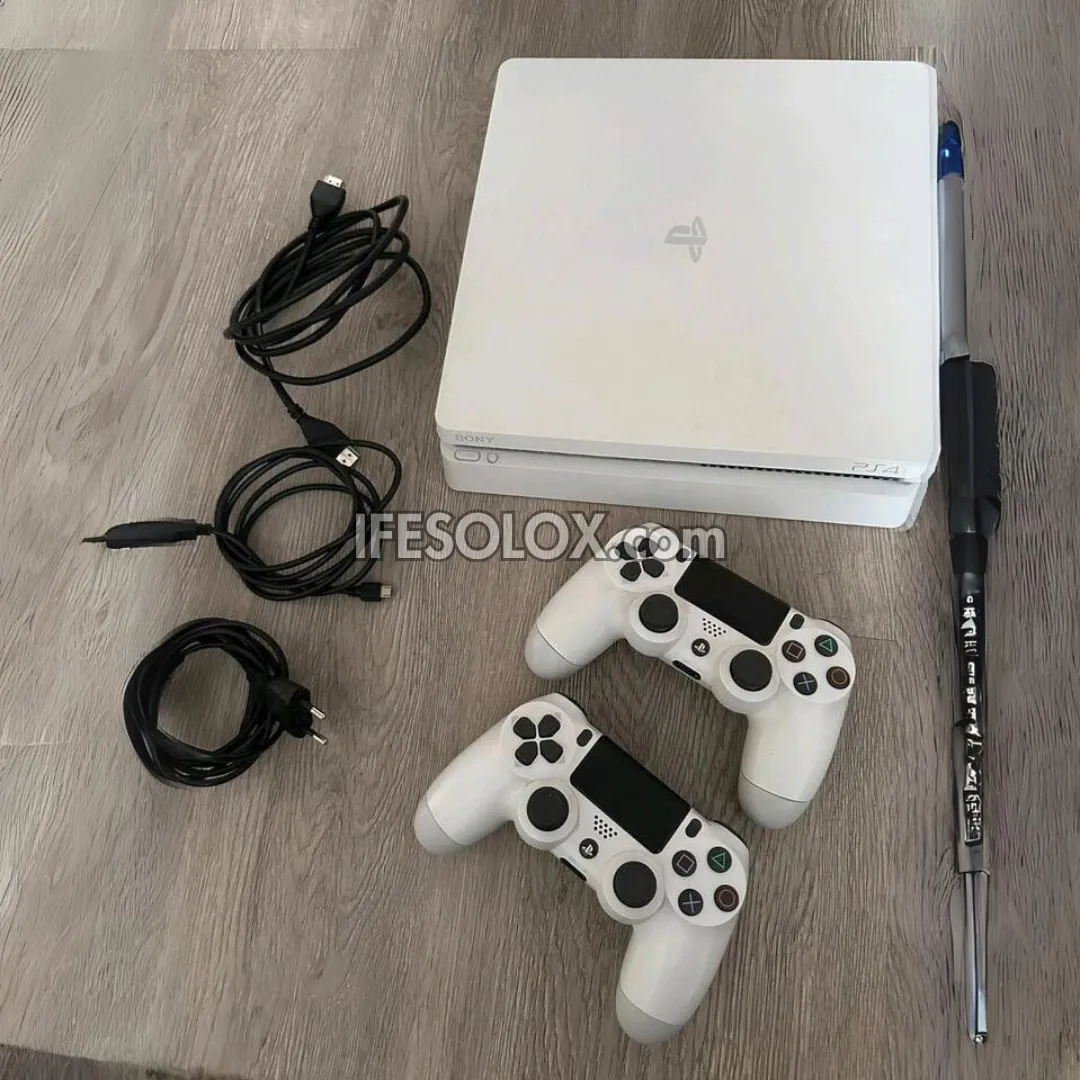 Sony Playstation 4 (PS4) Slim 1TB White Game Console with 2 DUALSHOCK 4 Controllers and 10 Games - Foreign Used